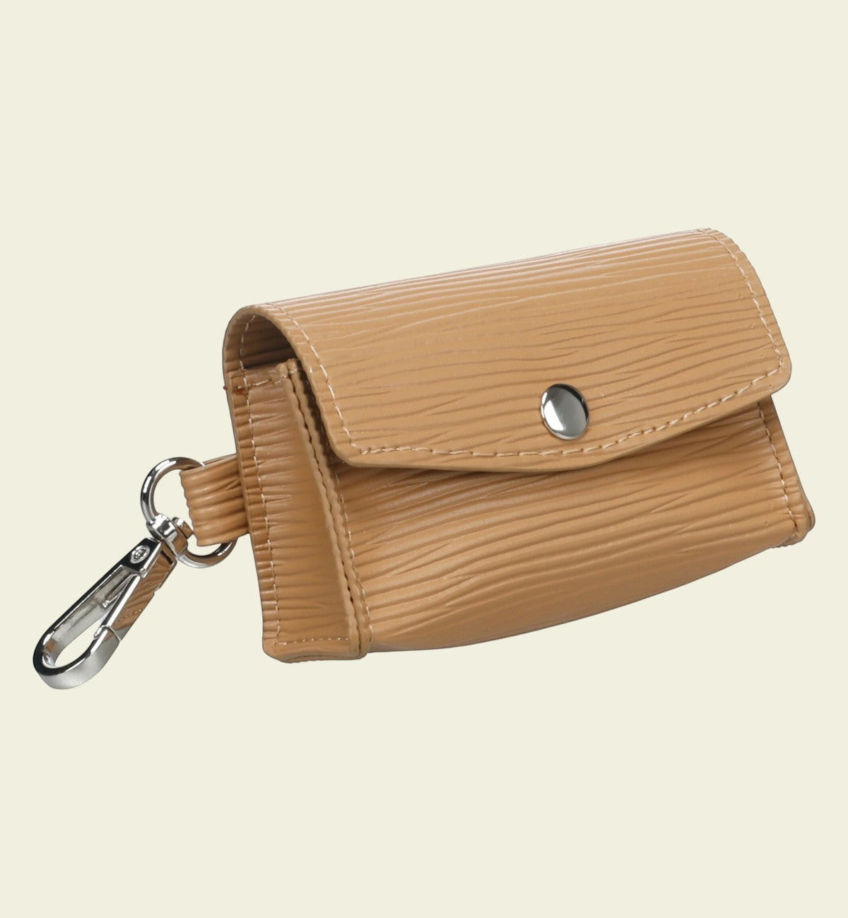Distributeur de sacs à déjections pour chien Animozen en polyester beige avec mousqueton et bouton-pression.
