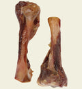 Animozen natural pork tibia bone dog chew, a long-lasting, meat-covered bone for dental hygiene and boredom relief.